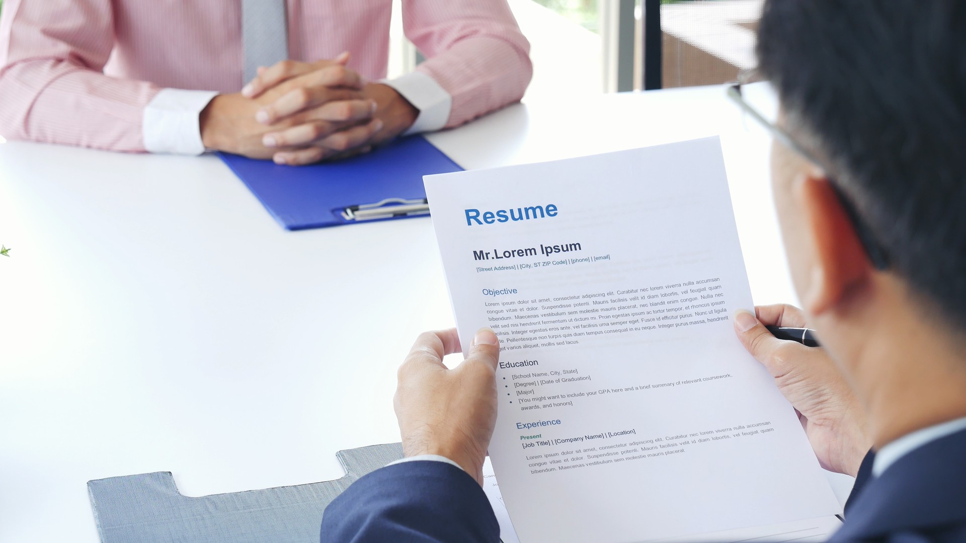 Businessman job interview by human resource HR officer interviwing, talk new employee shaking hands in office with smiling face. HR Manager interview check resume, face to face. Job Interview Concept