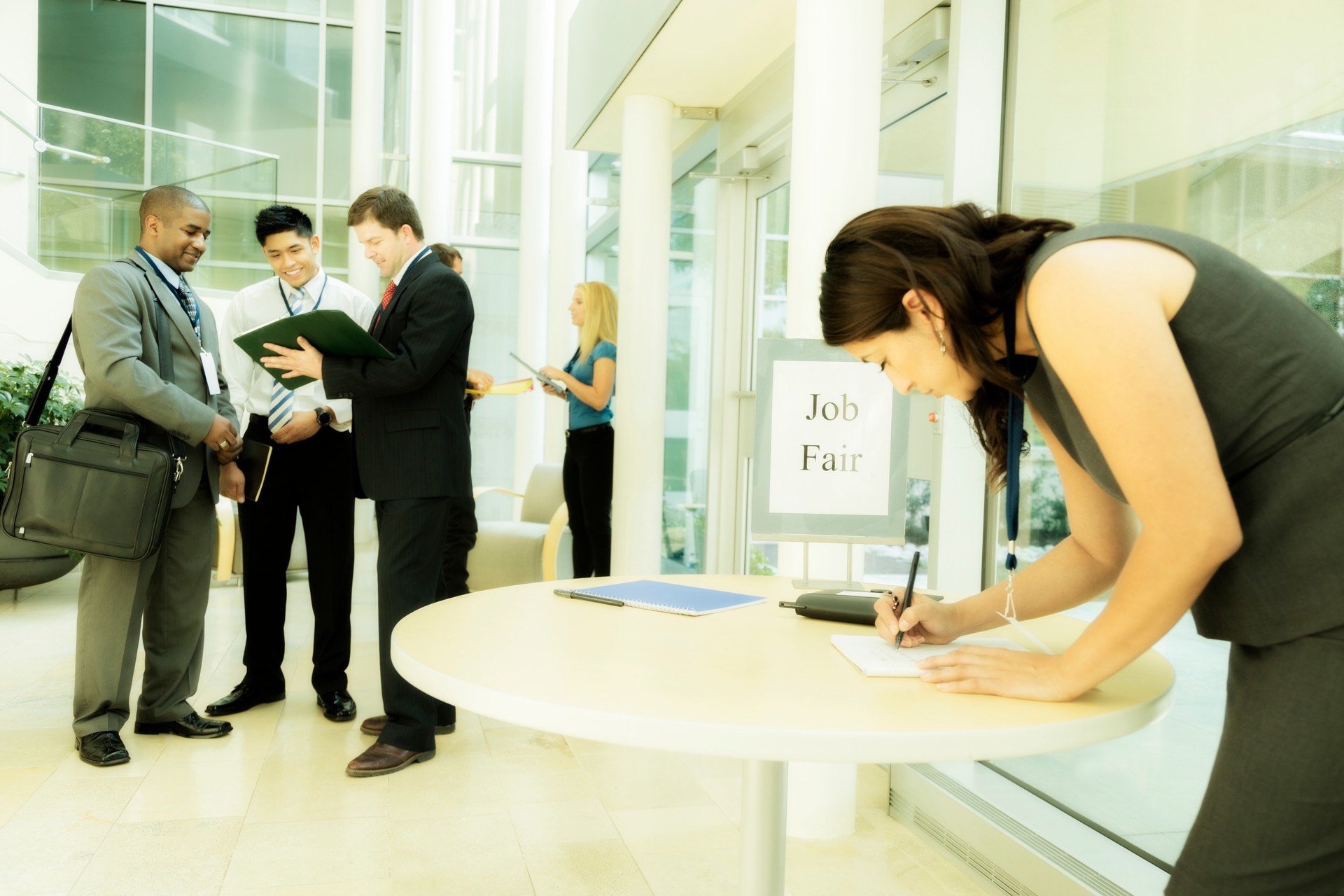 Business:  Unemployed young woman registers for local Job Fair.